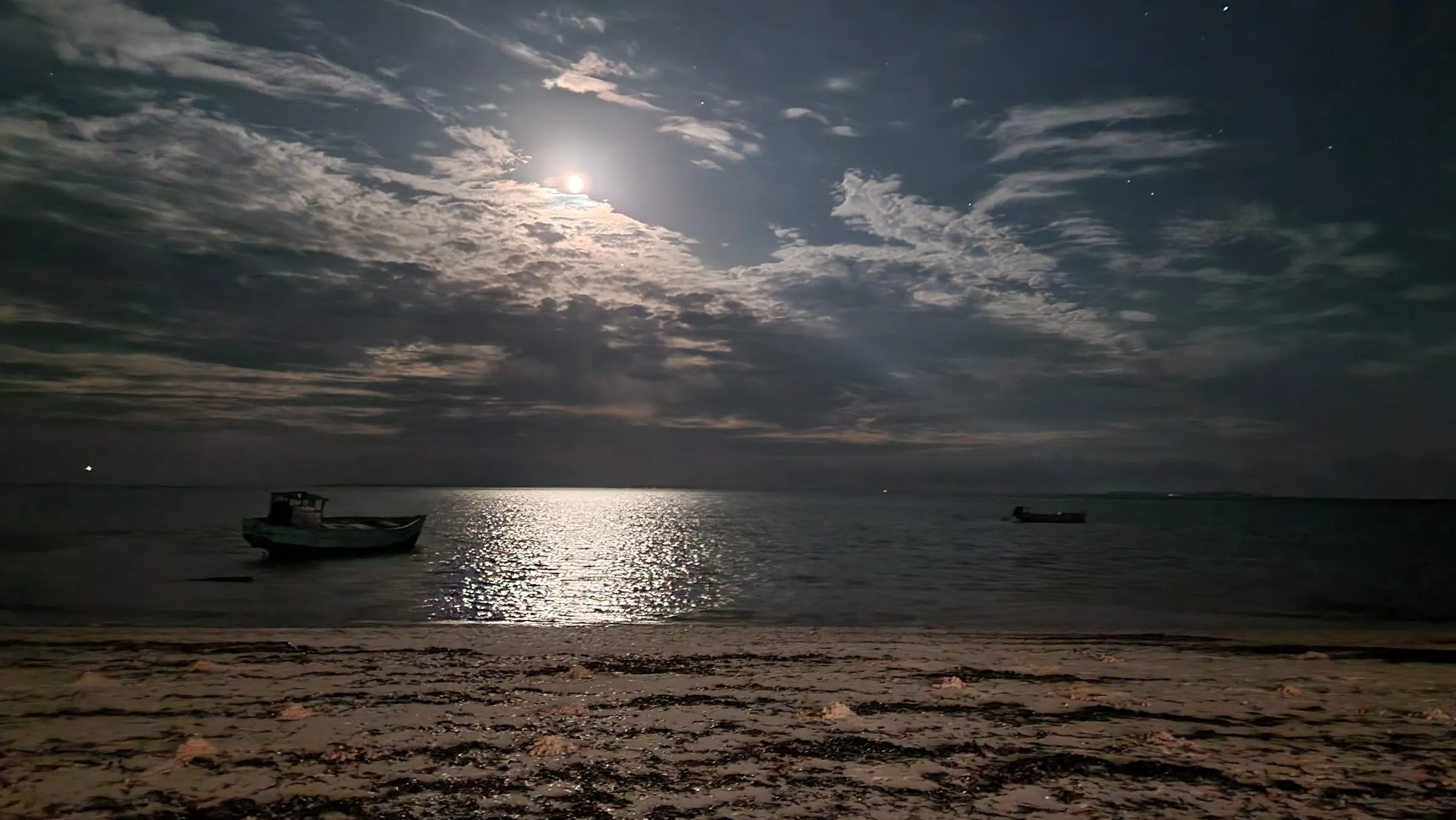 Moonlight over the bay at Vilankulo with fishing boats on the shore