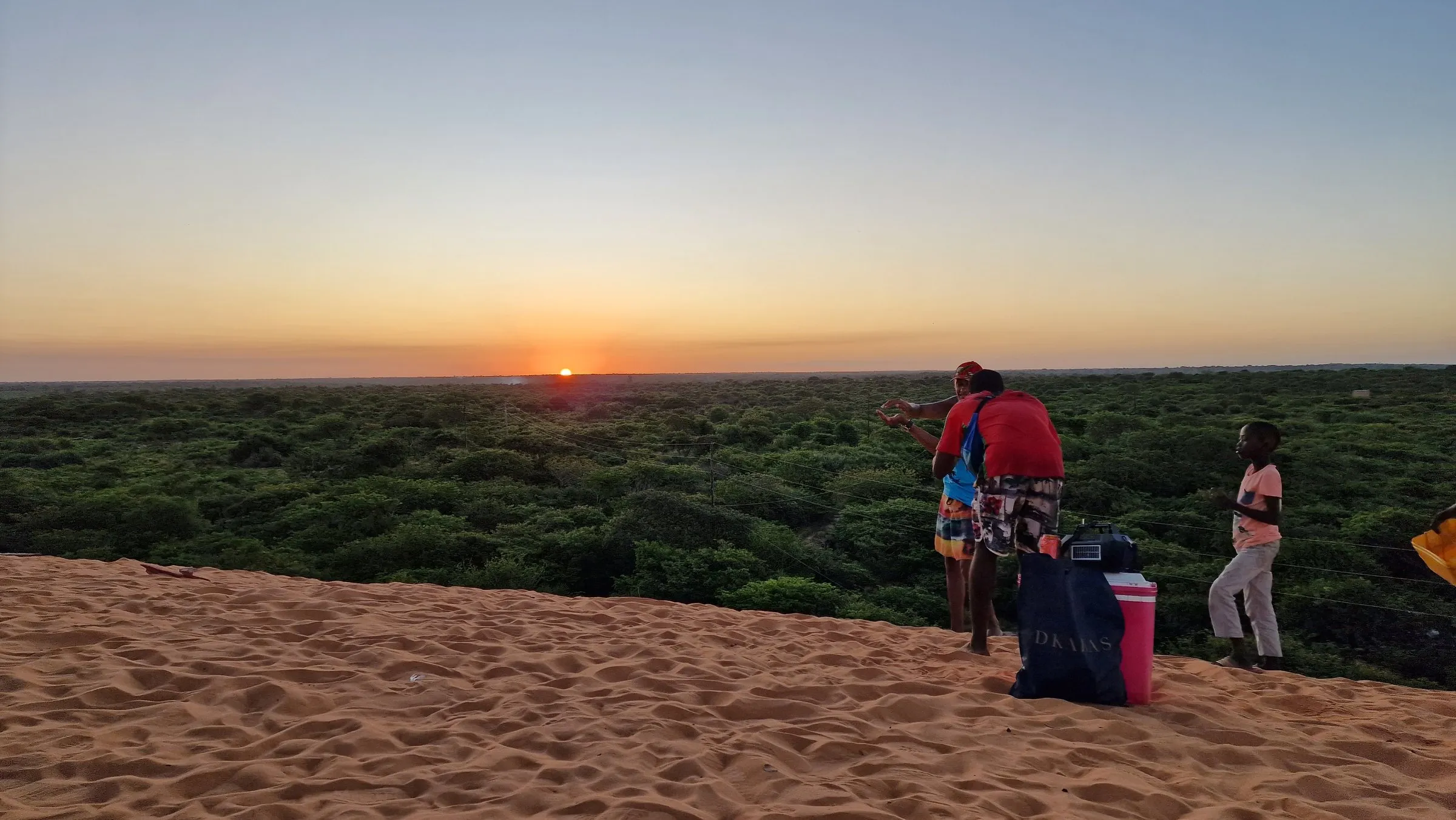 Sundowners on the red dunes above Vilankulo at sunset